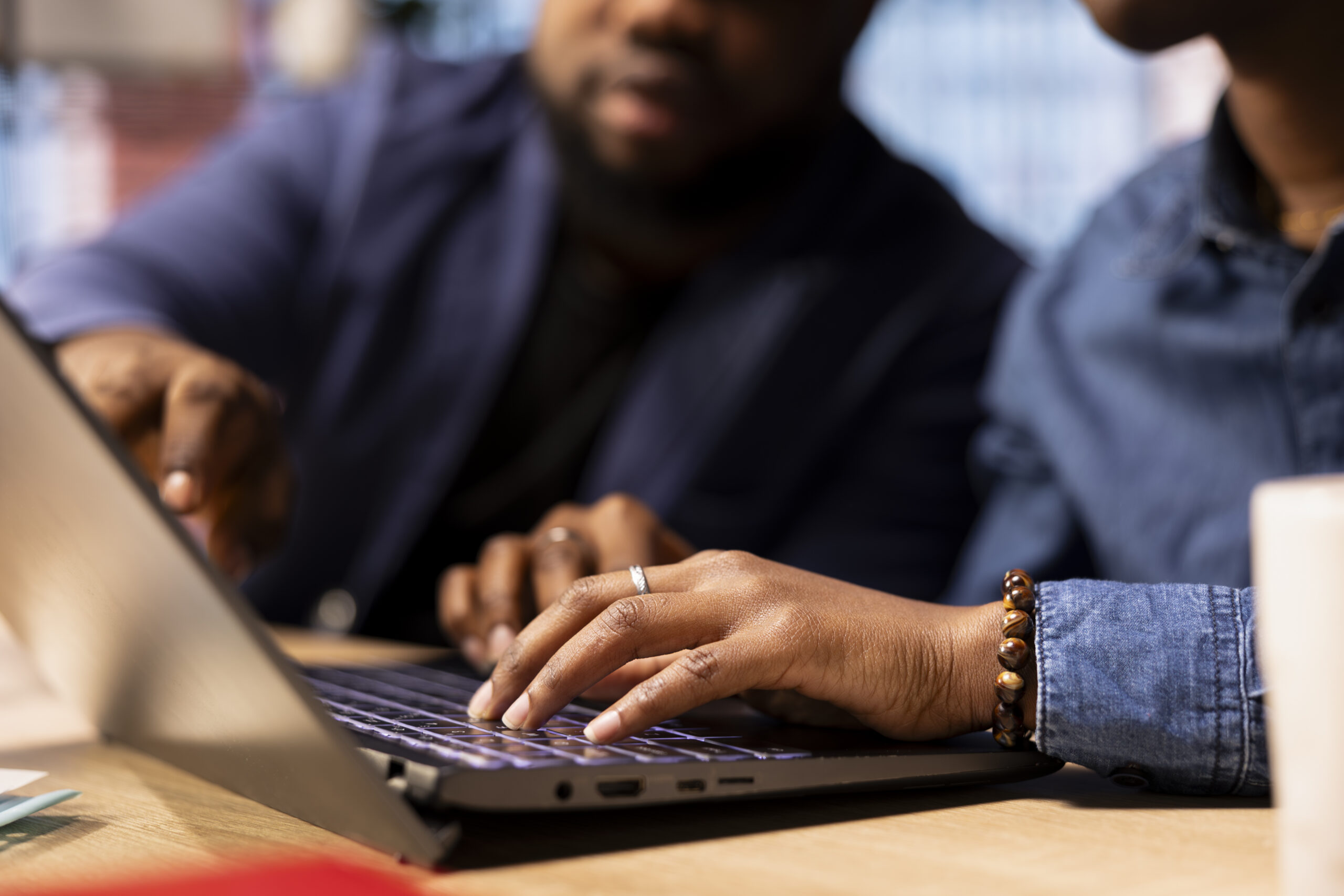 African American man and woman sits at a stylish home office